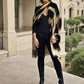 "Woman wearing a extra large cashmere wool wrap with snake print pattern showing luxury animal print design"