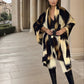 Image of a woman modeling snow leopard print cashmere extra large wool shawl demonstrating draping and styling"