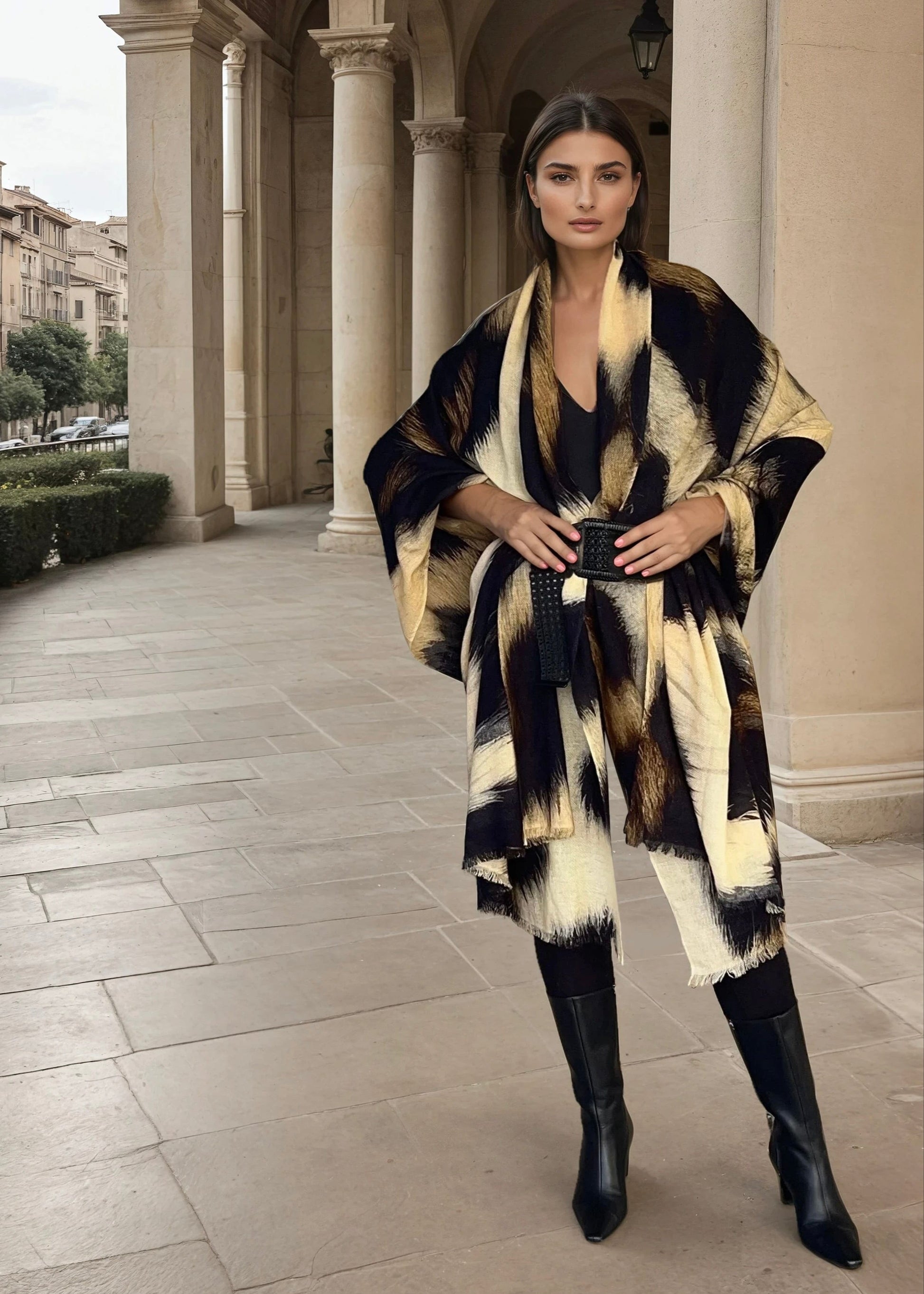 Image of a woman modeling snow leopard print cashmere extra large wool shawl demonstrating draping and styling"