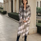 "Woman wearing limited edition hand tie-dyed extra large cashmere wrap in soft pink, taupe and brown showing unique color patterns"