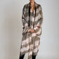 "Woman wearing limited edition hand tie-dyed cashmere wrap in soft pink, taupe and brown showing unique color patterns"