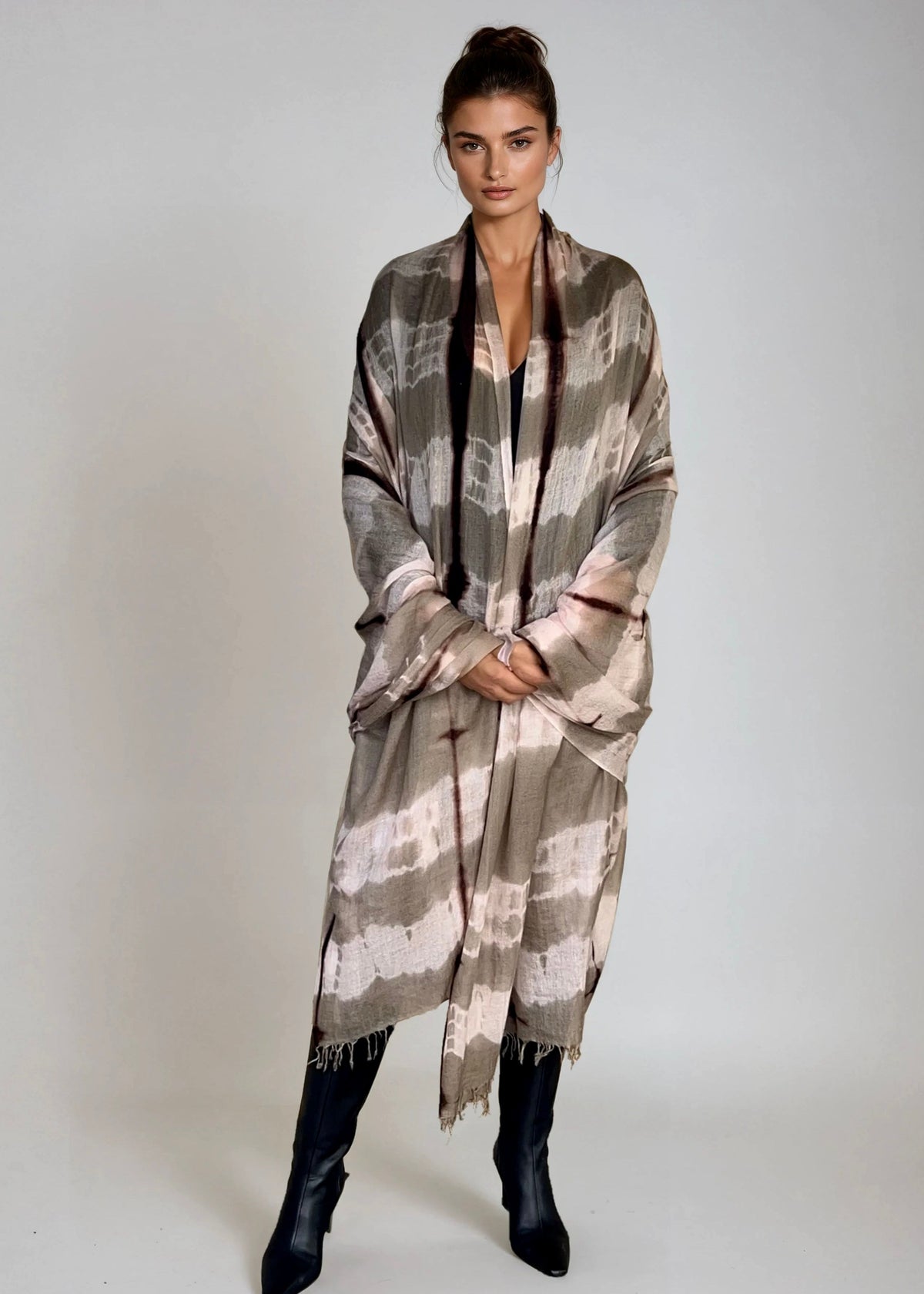 "Woman wearing limited edition hand tie-dyed cashmere wrap in soft pink, taupe and brown showing unique color patterns"