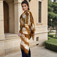 Image of woman wearing limited edition , extra large, hand tie-dyed cashmere shawl in bronze, white and brown showing unique color patterns"
