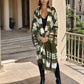 "Woman wearing limited edition hand tie-dyed, extra large cashmere wrap in  forest green, white and brown showing unique color patterns"