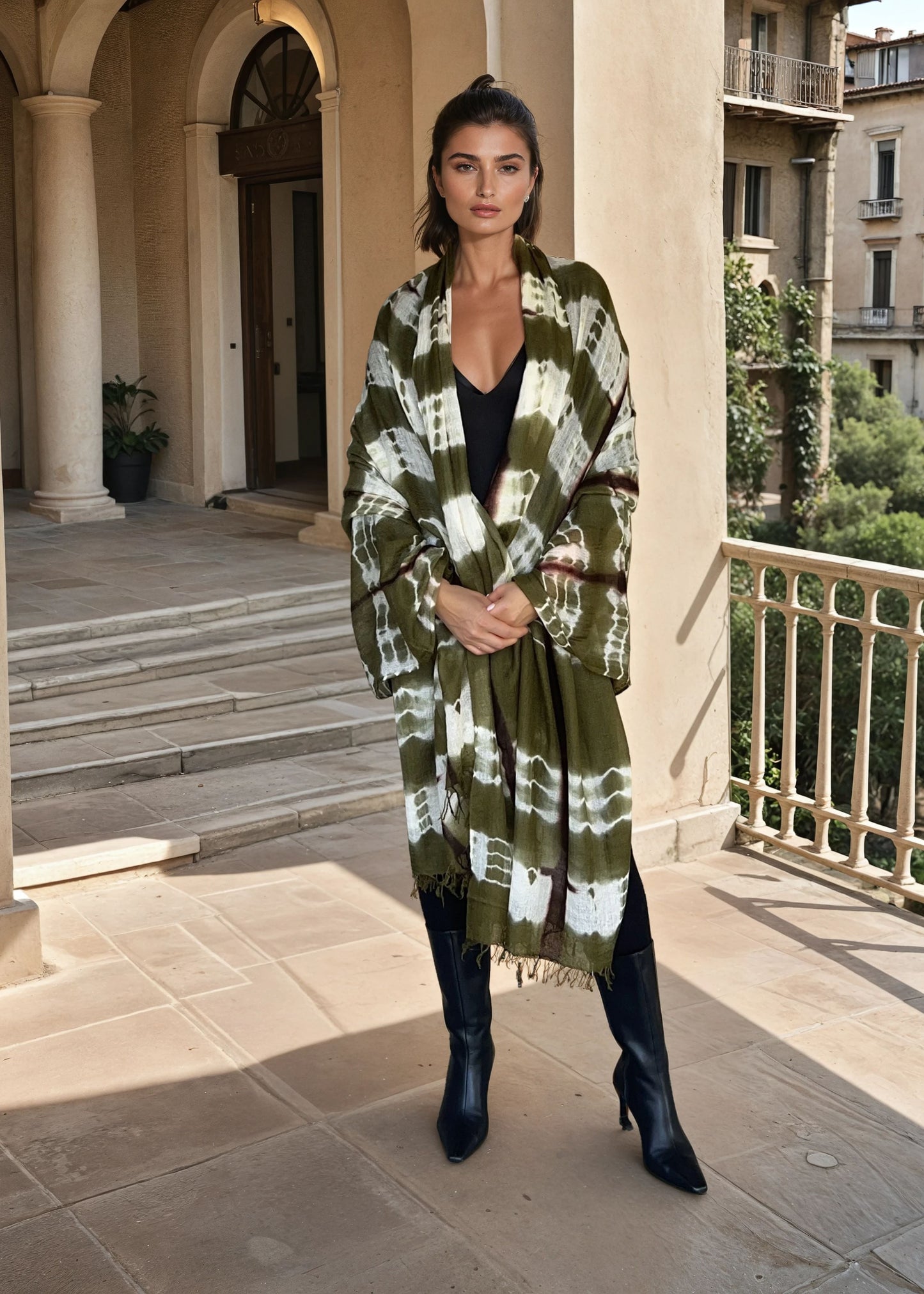 "Woman wearing limited edition hand tie-dyed, extra large cashmere wrap in  forest green, white and brown showing unique color patterns"