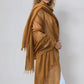 Burnt bronze cashmere wrap draped as oversized luxury shawl