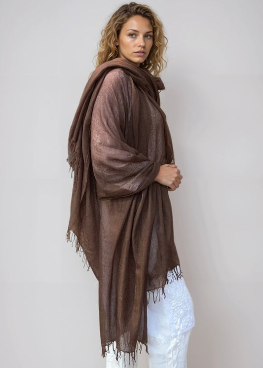 Model wearing an Earth Brown handwoven cashmere wrap, crafted in Nepal