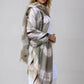 Taupe and soft pink cashmere wrap draped as oversized luxury shawl