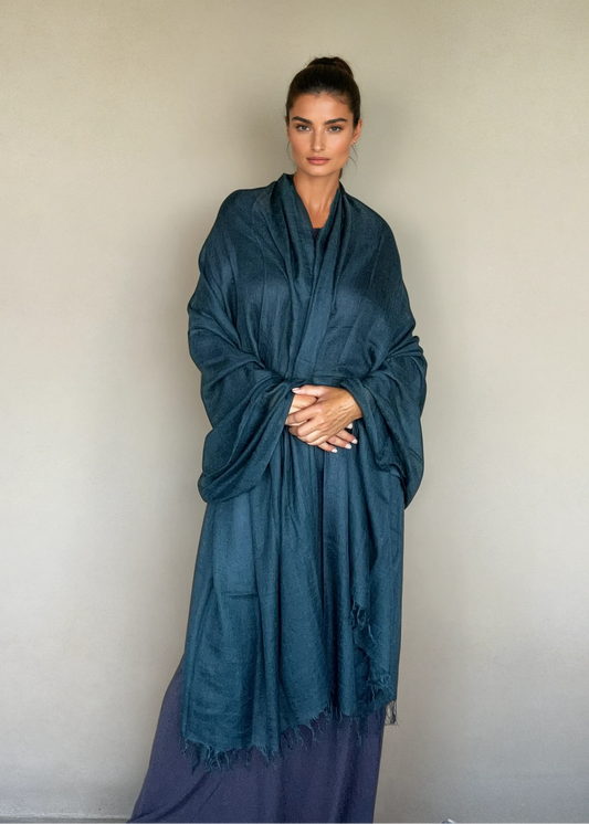 Luxury midnight teal cashmere shawl styled as an oversized wrap