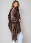 Model wearing an Earth Brown handwoven cashmere wrap, crafted in Nepal
